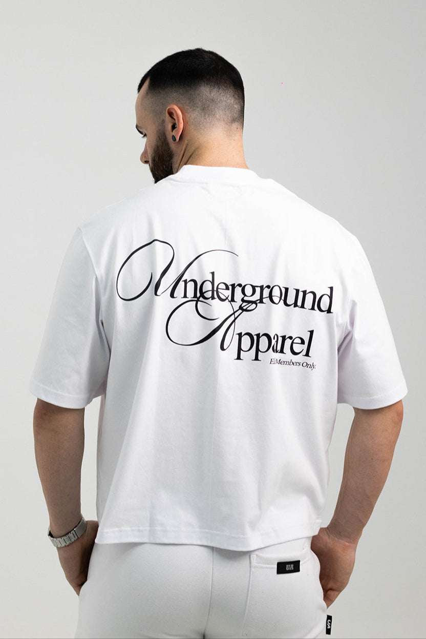 UA Cursive FCO White tee worn by model